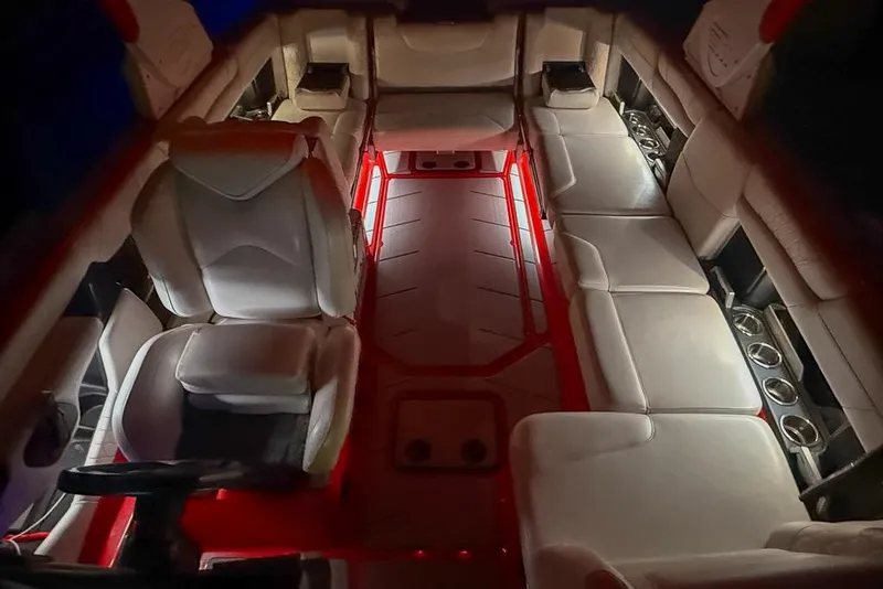 Slide: The Image of Luxurious interior of 2021 Malibu M240 boat with ambient red lighting. - 6