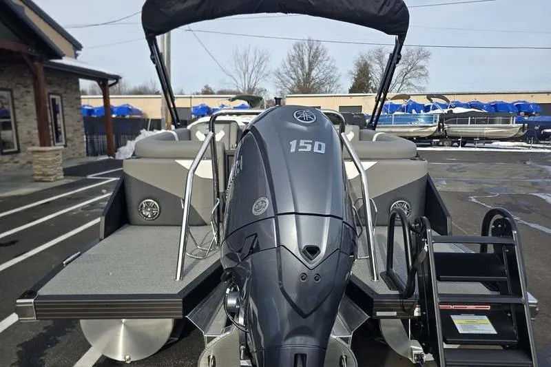 Slide: The Image of 2026 Evotti 521QL boat with powerful 150 HP outboard motor, docked outdoors. - 11
