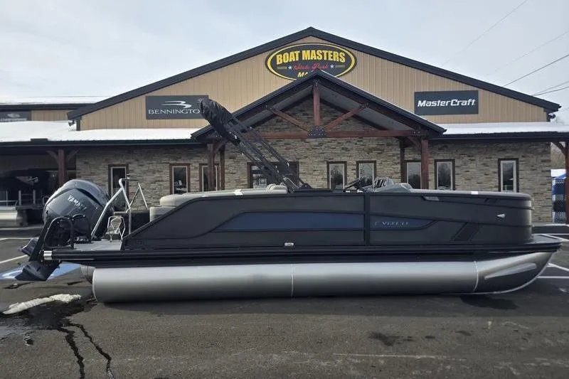 Slide: The Image of 2026 Evotti 521QL pontoon boat parked outside Boat Masters dealership. - 13