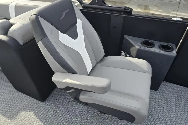 Slide: The Image of Gray and black seat in 2026 Evotti 521QL boat, featuring cup holders and armrest. - 14