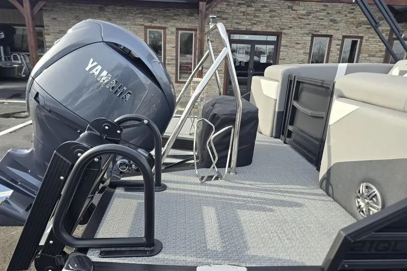 Slide: The Image of 2026 Evotti 521QL boat with Yamaha outboard motor, docked near a stone building. - 18