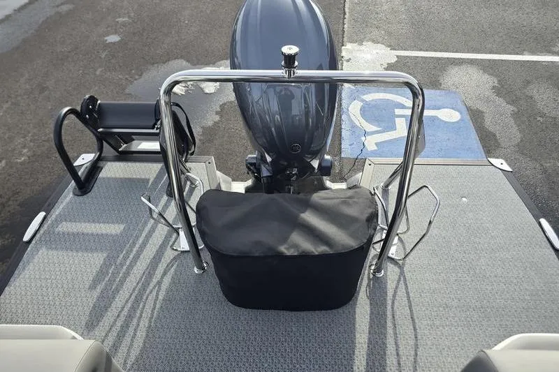 Slide: The Image of Evotti 521QL 2026 boat with outboard motor, parked on textured surface. - 19