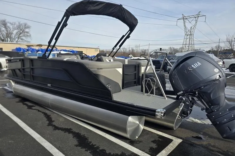 Slide: The Image of 2026 Evotti 521QL pontoon boat with Yamaha outboard motor in parking lot. - 5