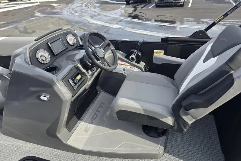 Slide: The Image of 2026 Evotti 521QL boat interior with steering wheel and dashboard controls. - 7