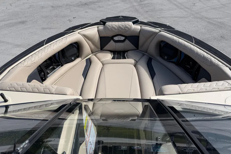 Slide: The Image of 2026 Centurion Ri230 boat interior with luxurious beige seating and modern design. - 12