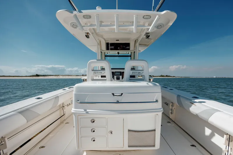 Slide: The Image of 2013 Boston Whaler 320 Outrage boat interior with ocean view and clear sky. - 28
