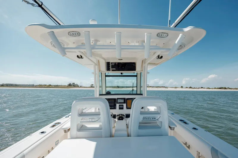 Slide: The Image of 2013 Boston Whaler 320 Outrage boat interior with ocean view and clear sky. - 32