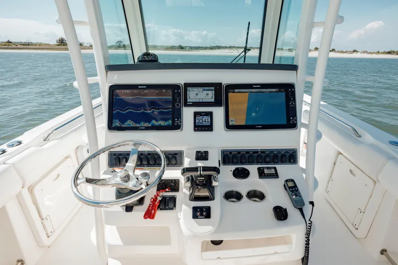 Slide: The Image of 2013 Boston Whaler 320 Outrage helm with advanced navigation systems and controls. - 34