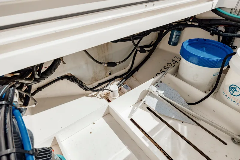 Slide: The Image of Interior view of a 2013 Boston Whaler 320 Outrage boat, showing storage and equipment. - 47