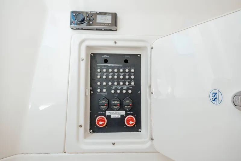 Slide: The Image of Electrical panel and control system on a 2013 Boston Whaler 320 Outrage boat. - 52