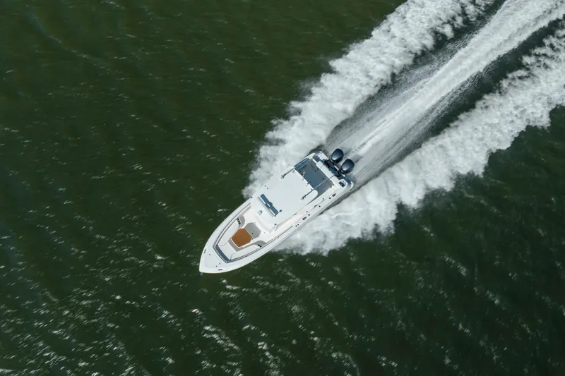 Slide: The Image of Aerial view of 2013 Boston Whaler 320 Outrage speeding on open water. - 7