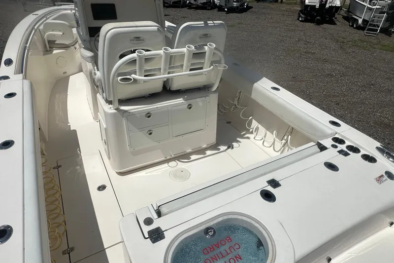 Slide: The Image of 2023 Cobia 262 Center Console boat interior with seating and storage compartments. - 10