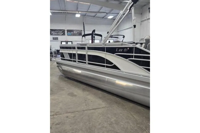 Slide: The Image of 2024 Bennington 22 LSB pontoon boat in showroom, side view. - 10
