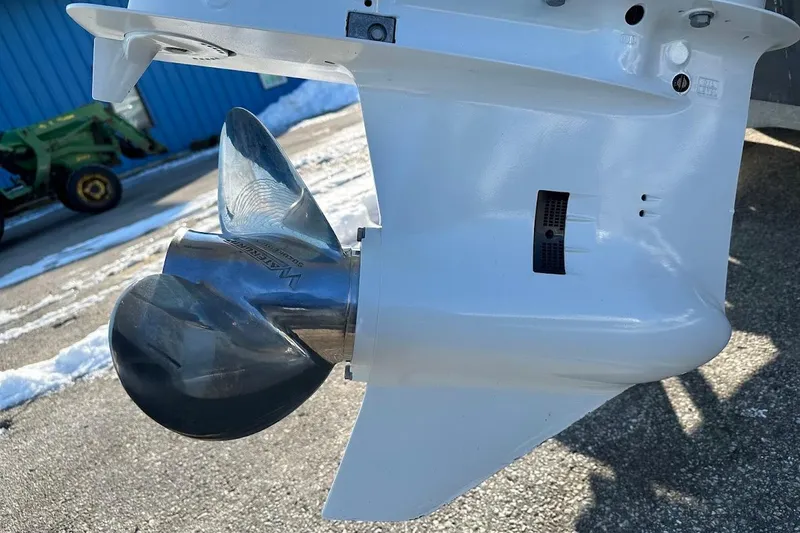 Slide: The Image of Close-up of a 2022 Sea Pro 219 Center Console boat propeller in a sunny outdoor setting. - 12