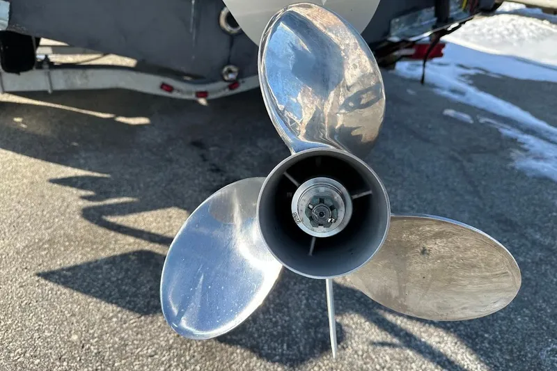 Slide: The Image of Propeller of 2022 Sea Pro 219 Center Console boat on asphalt surface. - 13