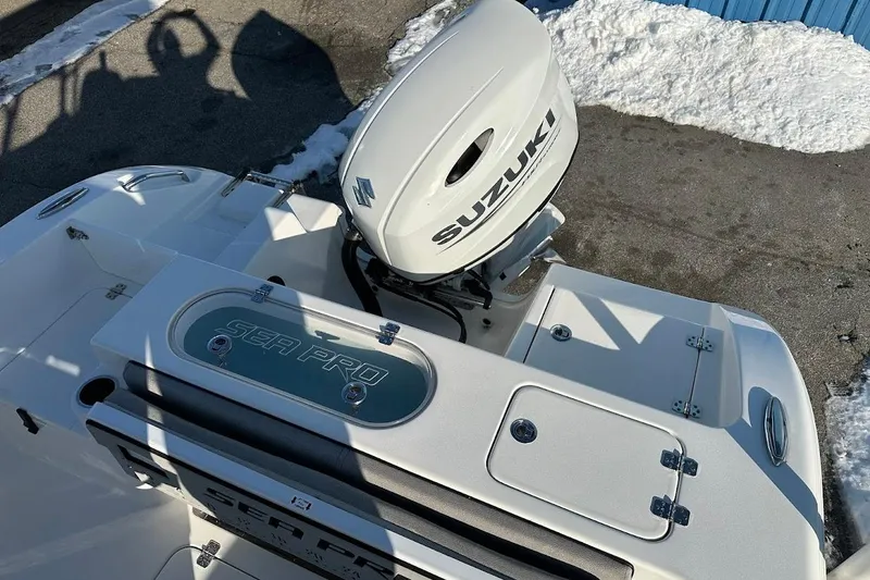 Slide: The Image of 2022 Sea Pro 219 Center Console boat with Suzuki engine, parked on snowy pavement. - 15