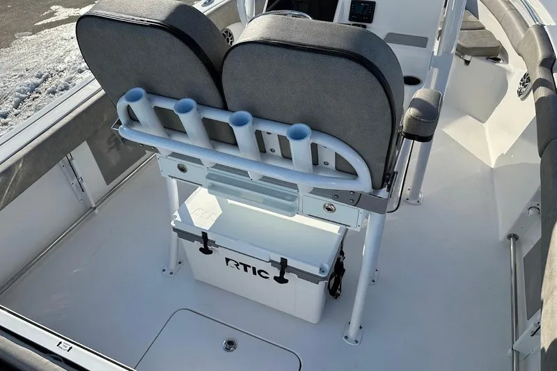 Slide: The Image of 2022 Sea Pro 219 Center Console interior with seating and storage. - 17