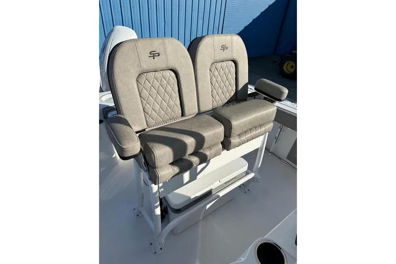 Slide: The Image of 2022 Sea Pro 219 Center Console boat seats with quilted design and armrests. - 19
