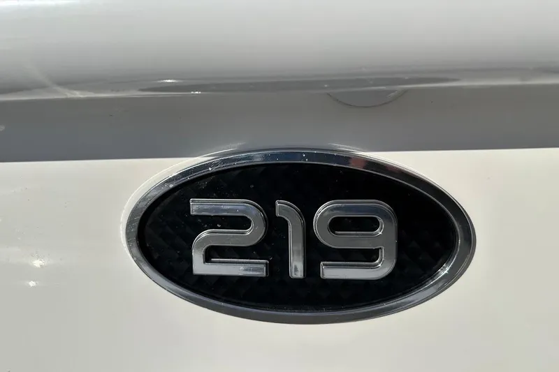 Slide: The Image of Sea Pro 219 Center Console 2022 model emblem on white surface. - 20