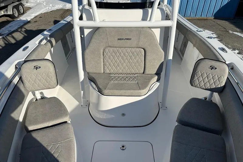 Slide: The Image of 2022 Sea Pro 219 Center Console boat interior with gray cushioned seating. - 28