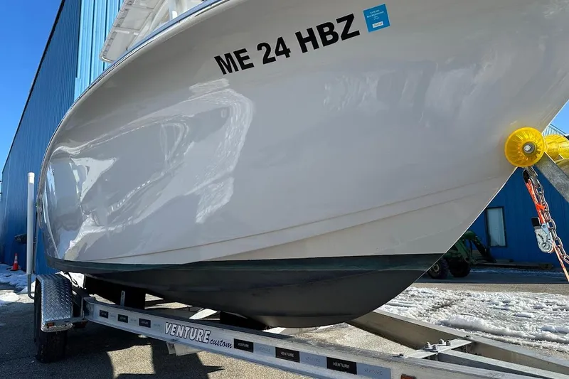 Slide: The Image of 2022 Sea Pro 219 Center Console boat on trailer, side view, with registration number ME 24 HBZ. - 6