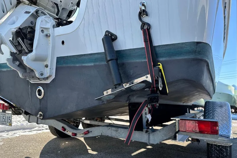 Slide: The Image of 2022 Sea Pro 219 Center Console boat on trailer, showing motor and hull details. - 8