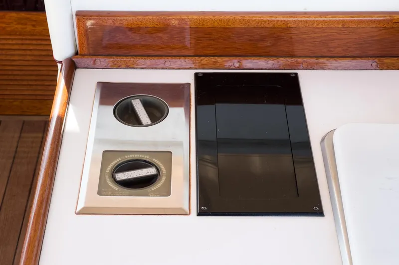 Slide: The Image of Control panel of a 1991 Windsor Craft 31 Sport Cruiser with wooden trim. - 26