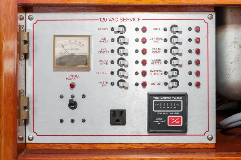 Slide: The Image of Control panel of a 1991 Windsor Craft 31 Sport Cruiser with various switches and gauges. - 28