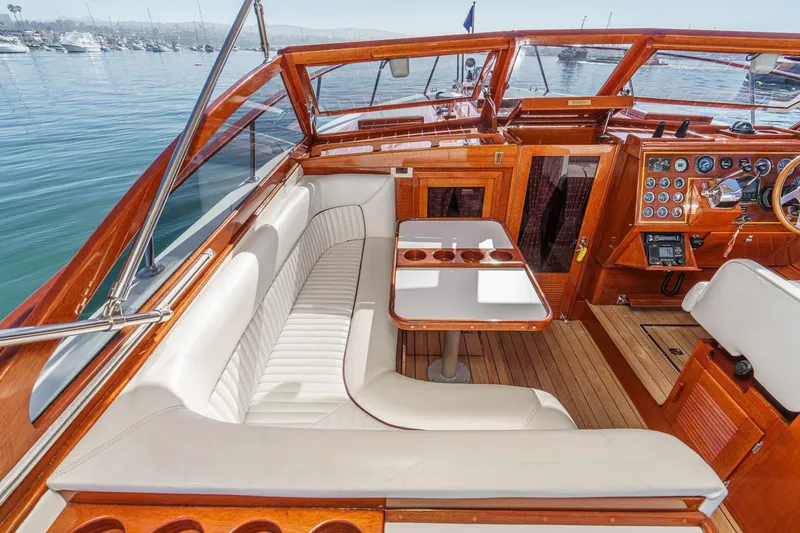 Slide: The Image of Luxurious 1991 Windsor Craft 31 Sport Cruiser interior with elegant wood finish and plush seating. - 31