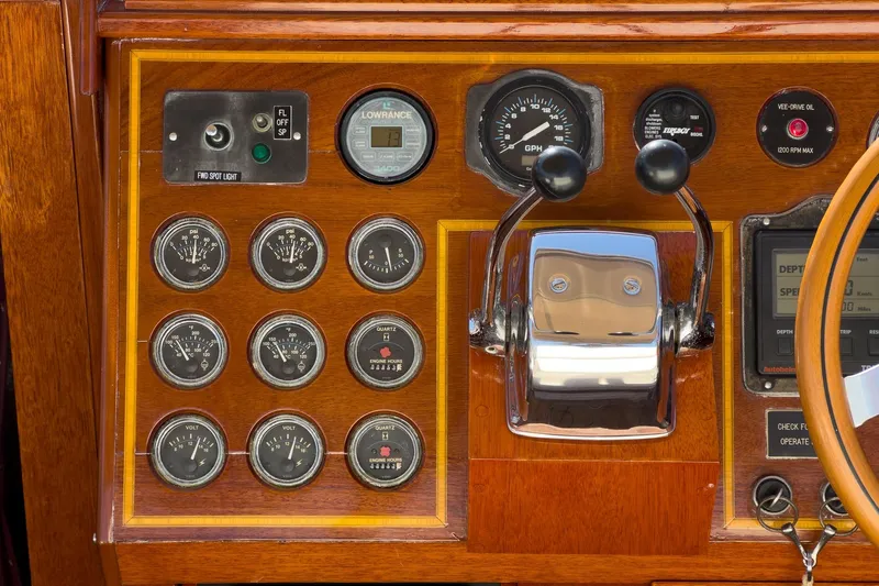 Slide: The Image of Control panel of a 1991 Windsor Craft 31 Sport Cruiser with gauges and throttle. - 36