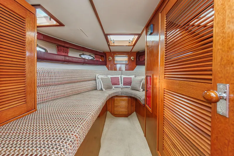 Slide: The Image of Interior of 1991 Windsor Craft 31 Sport Cruiser with cozy seating and wooden cabinetry. - 45