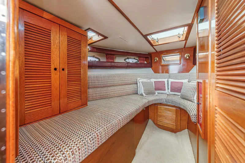Slide: The Image of Luxurious interior of 1991 Windsor Craft 31 Sport Cruiser with cozy seating and wooden accents. - 46