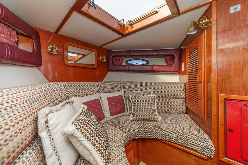 Slide: The Image of Interior of 1991 Windsor Craft 31 Sport Cruiser with cozy seating and wooden accents. - 47