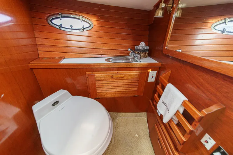 Slide: The Image of Luxurious wooden bathroom interior of 1991 Windsor Craft 31 Sport Cruiser yacht. - 50