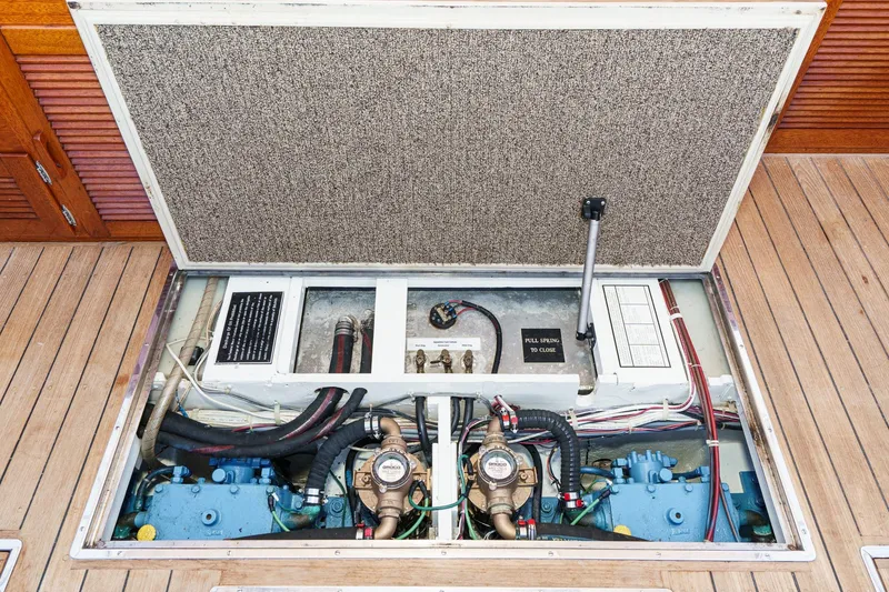 Slide: The Image of Engine compartment of a 1991 Windsor Craft 31 Sport Cruiser, showcasing mechanical components. - 51