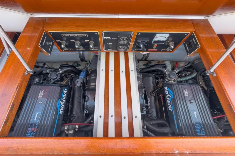 Slide: The Image of Engine compartment of a 1991 Windsor Craft 31 Sport Cruiser with MerCruiser engines. - 52