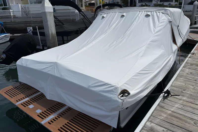 Slide: The Image of Covered 1991 Windsor Craft 31 Sport Cruiser docked at marina. - 64