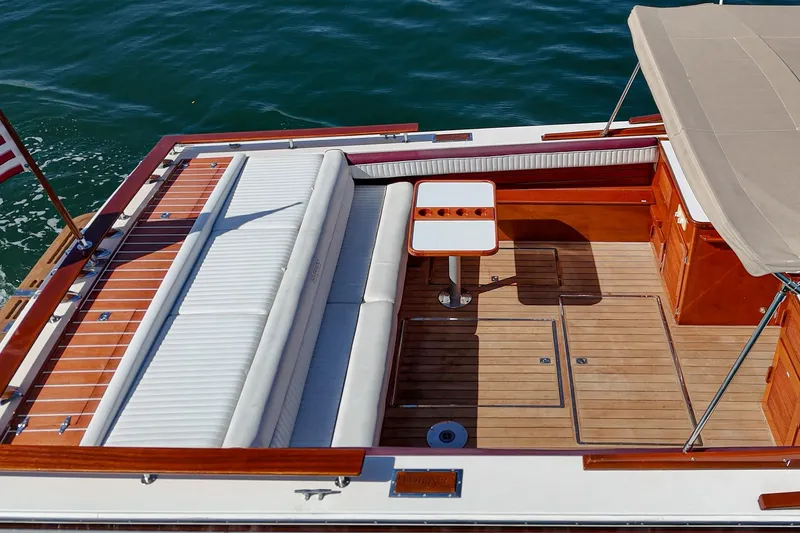 Slide: The Image of 1991 Windsor Craft 31 Sport Cruiser with elegant wood deck and seating area. - 8