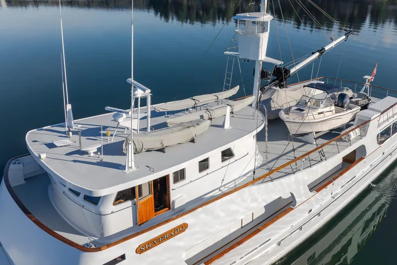 Slide: The Image of Vintage 1974 Willard 1201 yacht, "Silverado," docked on calm water. - 10