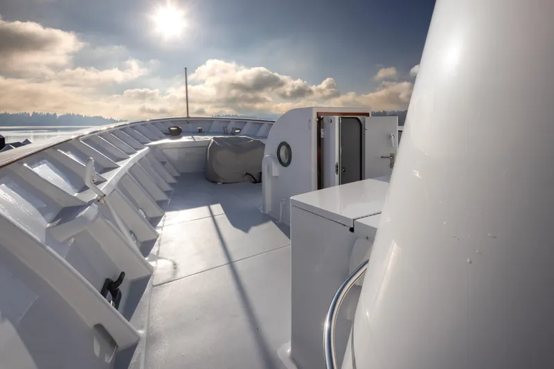 Slide: The Image of 1974 Willard 1201 boat deck under sunny sky with clouds. - 14