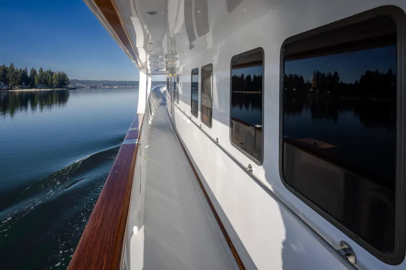 Slide: The Image of Side view of 1974 Willard 1201 yacht cruising on a calm lake. - 20