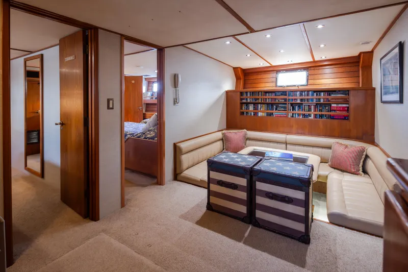 Slide: The Image of Luxurious 1974 Willard 1201 yacht interior with cozy seating and bookshelf. - 28
