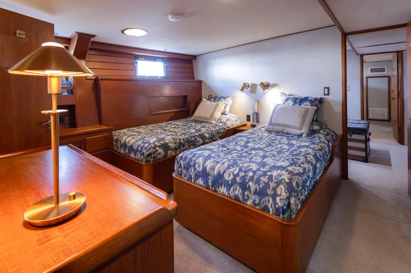 Slide: The Image of Luxurious 1974 Willard 1201 yacht cabin with twin beds and elegant wooden furnishings. - 35