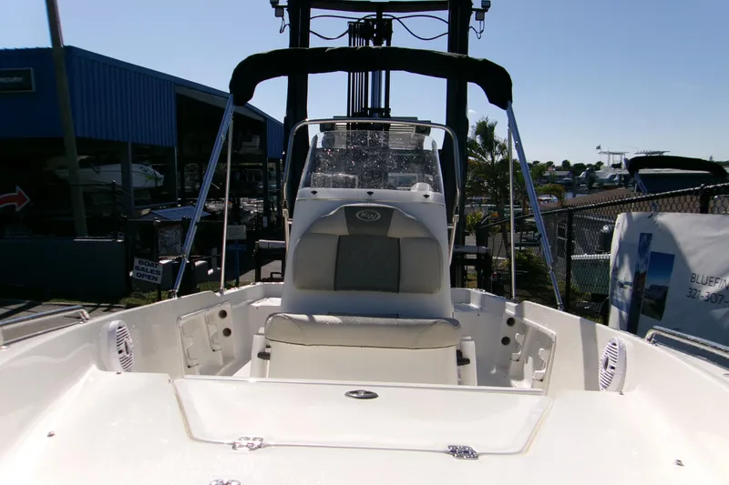 Slide: The Image of 2026 Key West 1720 Center Console boat at a marina, showcasing seating and console. - 12