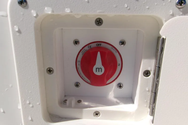 Slide: The Image of Battery switch on 2026 Key West 1720 Center Console boat, with water droplets. - 14