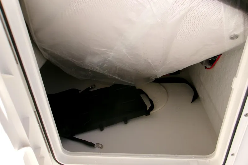 Slide: The Image of Storage compartment of 2026 Key West 1720 Center Console boat, featuring interior view. - 18