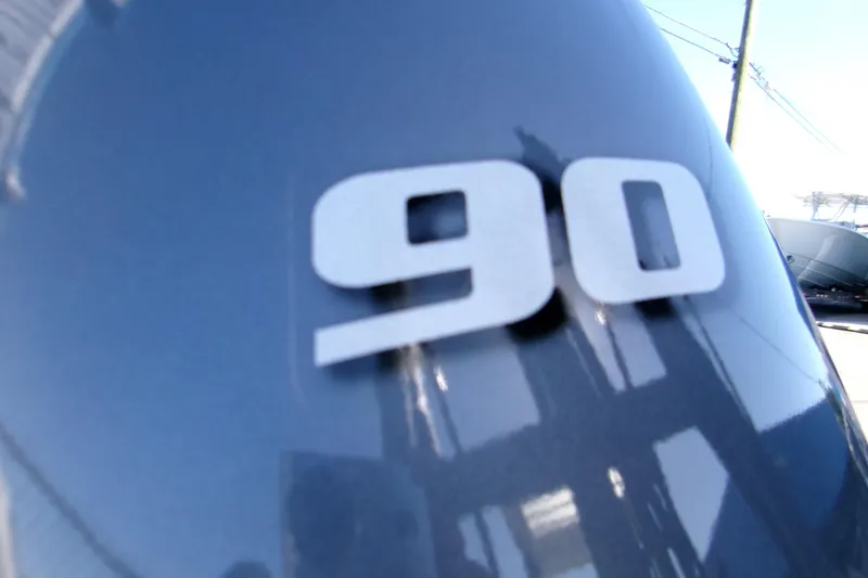 Slide: The Image of Close-up of '90' on 2026 Key West 1720 Center Console boat engine. - 6