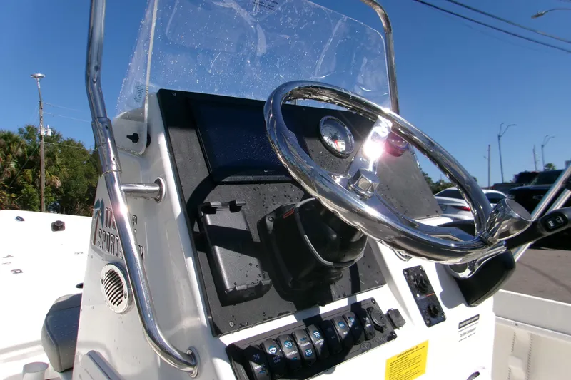 Slide: The Image of 2026 Key West 1720 Center Console boat steering wheel and dashboard close-up. - 8