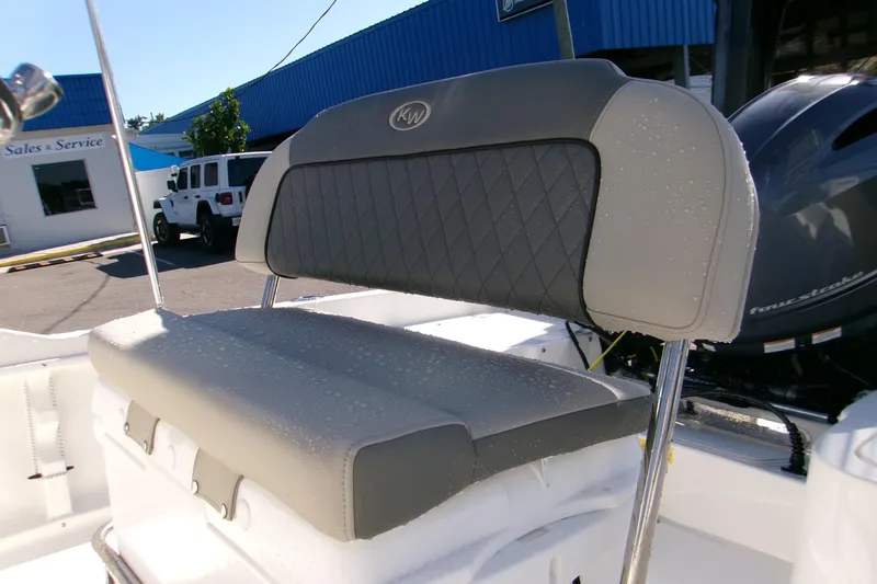 Slide: The Image of 2026 Key West 1720 Center Console boat seat with water droplets, outdoor dealership setting. - 9
