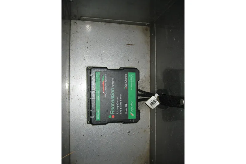 Slide: The Image of Battery charger in a 2016 Lund 1775 Impact SS boat compartment. - 15